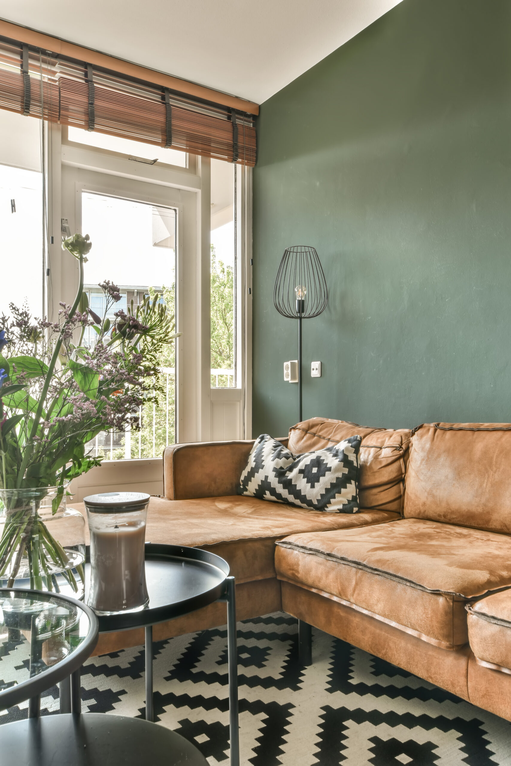 a living room with a brown couch and a table